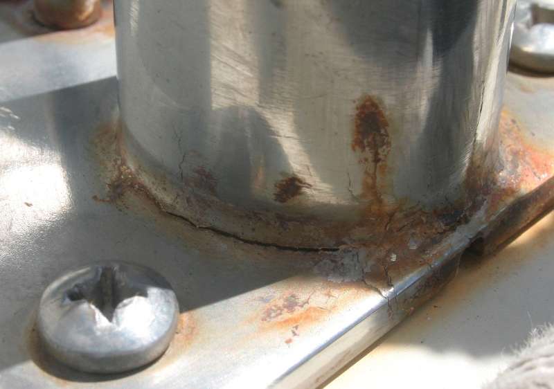 Crevice corrosion cracks at bottom of stanchion base